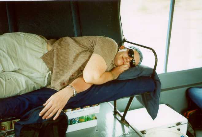 kerrie sleeping on the truck.jpg - 25603 Bytes