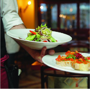 Server holding two plates