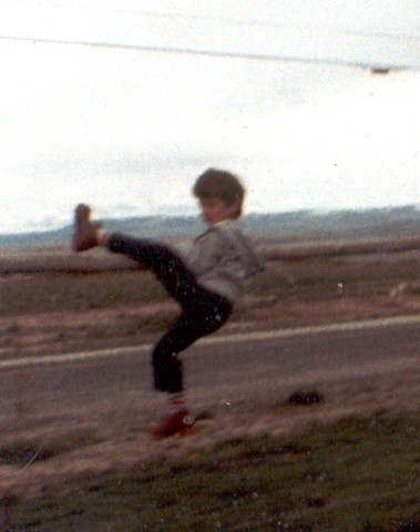 Me in 1982 Climbing the Fence