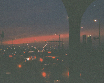 Dark Orange sunset viewed from driver's seat, looking up Roosevelt Road
