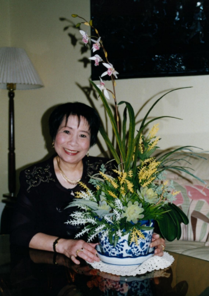 Kiem with an orchid arrangement