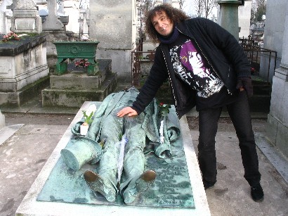 scary vagrant man fondling a dead guy's crotch