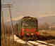 Passenger train running through Fossa station