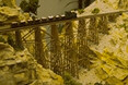 Tiny quarry trains crossing a gorge
