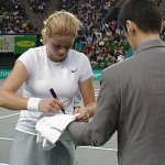 Kim signing something