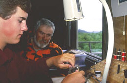 Tying flies can be a great way to relax after a long day of fishing.