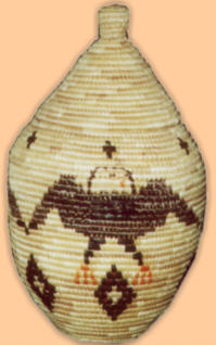This beautiful grass-woven basket
   was made by Mollie Chingliak!