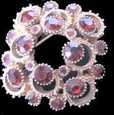Sphinx fancy metalwork and garnet chaton brooch