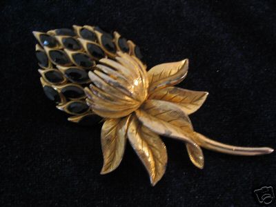 Sphinx goldtone flower with jet rhinestones 