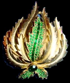 Sphinx signed emerald + goldtone brooch