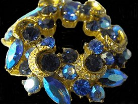 Crescents on a sapphire Sphinx Wreath brooch