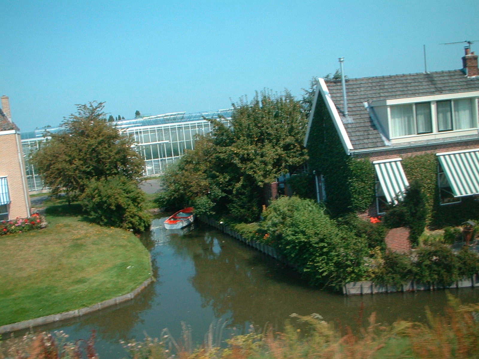 04 aug 2003 Dutch houses & canal with greenhouses in background
