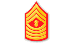 MGYSGT, 3 Chevrons and 4 Rockers with a red background and a bomb in middle.