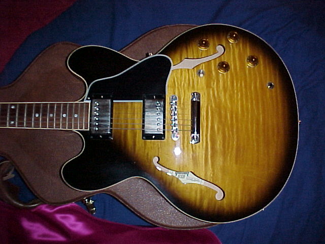Koosman with his red Stratocaster & his Gibson ES335 tiger stripe.