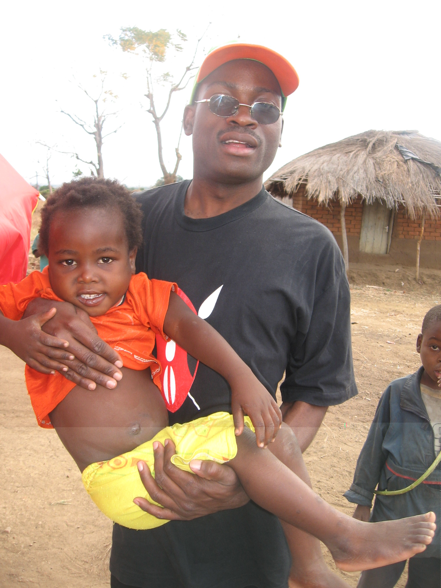 Kumbu' Kuntiya with a kid in Mangochi
