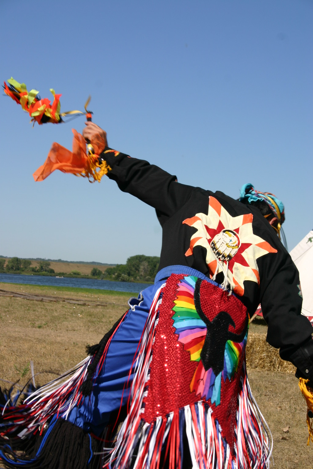 This photo depicts "tapping down" the grass for the festival to come.&nbsp; Brad Sherwood is from the Lakotah Nation.&nbsp; Used with permission.