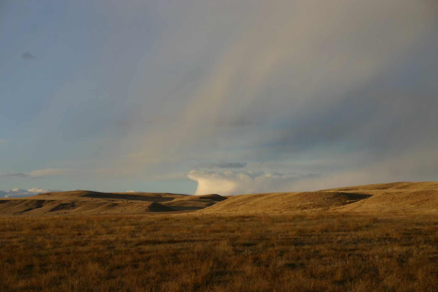 This cloud formation seems to rise up out of the prairie fields.&nbsp; Taken at the western edge of the Pine Ridge Indian Reservation in South Dakota.