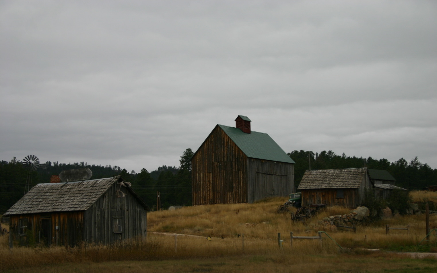 The old wood buildings in this photo caught my eye as to how life used to be.