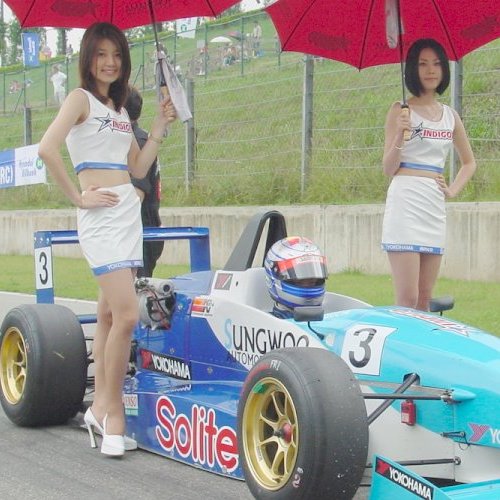 Sitting so low in his race car, the driver has ample viewing up skirts.