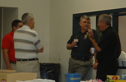 Fr. DeMartino talks with his Knights at a Sunday Donut Social