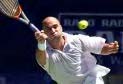 [Andre Agassi diving for the ball]