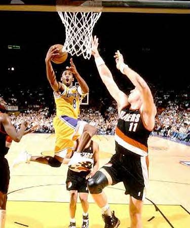 [Kobe Bryant taking a lay-up during the game]