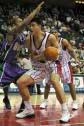 [Yao Ming dribbles past opponents]