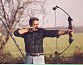 Russ practicing shooting bow&arrow at Jimmy's farm, 1981