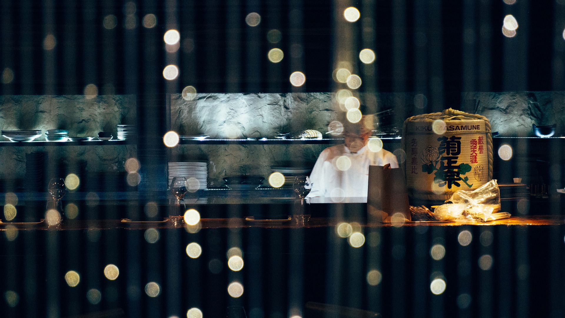 Chef behind a curtain of lights