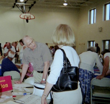 Rev. John R. Weiler Talks with Attendees