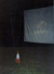 Mac watches his first outdoor movie (Devil and Daniel Mouse)... standing a bit close