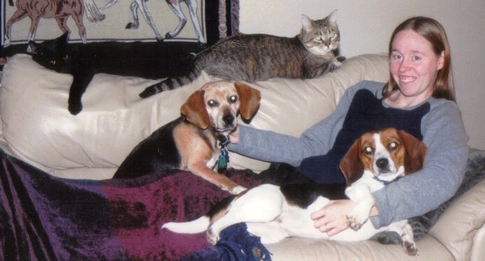 The entire Spontak Pack relaxing with Nat on the couch.