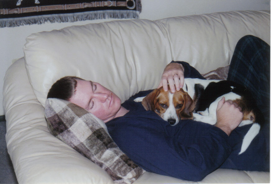 Kyle and Ella napping on the couch.