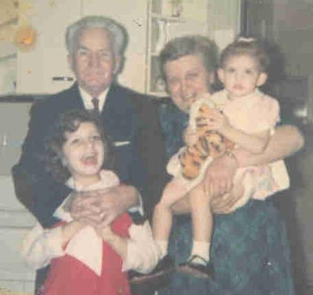 Photo of me (left) with my sister and grandparents.
