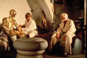 Ben, Luke and C-3PO in Kenobi's hut