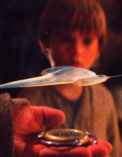 Qui-Gon Jinn uses a holoprojector to persuade Watto with a bet