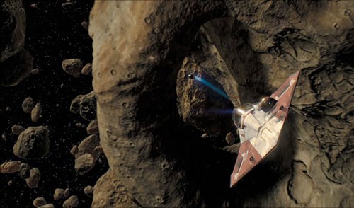 The Jedi Starfighter weaves through the asteroid rings of Geonosis