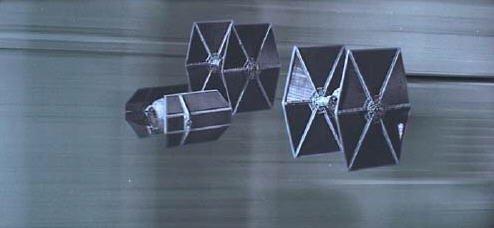 Darth Vader and his wingmen chase Rebel X-wings down the Death Star's trench