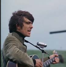 George singing I Need You in the movie, Help! 1965.
