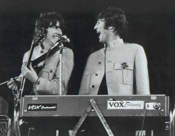 George laughing at John's antics at the harmonium at Shea, August 15,1965.