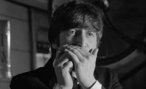 John playing the harmonica in the song I Should Have Known Better in the movie, A Hard Day's Night 1964.