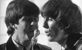 Paul and George singing the song She Loves You (ooooh!) in the movie, A Hard Day's Night 1964.