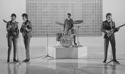 The Beatles singing the song She Loves You in the movie, A Hard Day's Night 1964.