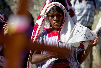 An indigenous Tzotzil woman prays for peace