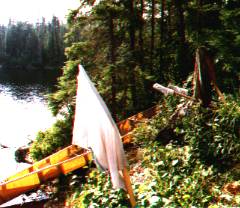 Canoe, paddles, laundry