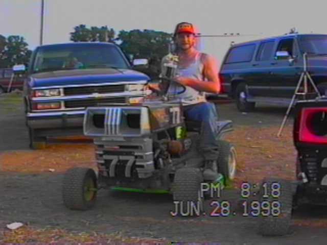 LARRY POTENZA WITH TROPHY AND GRAVE DIGGER