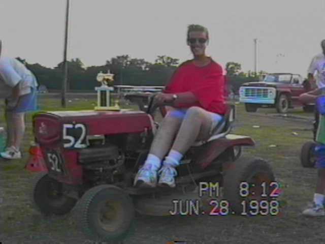 SALLY HONCHELL WITH HER MOWER AND TROPHY