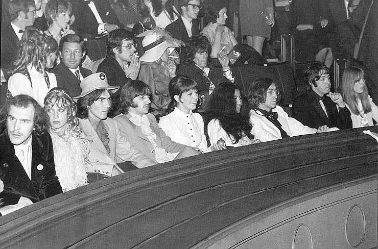 Neil Aspinall, Pattie, George, Ringo, Maureen, Yoko, John, Paul and Jane. Behind John and Yoko is Keith Richards.