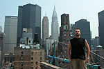 Milton on the roof with the NYC skyline in the background