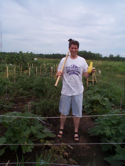 Eric with a yellow squash...&nbsp; mmmm.